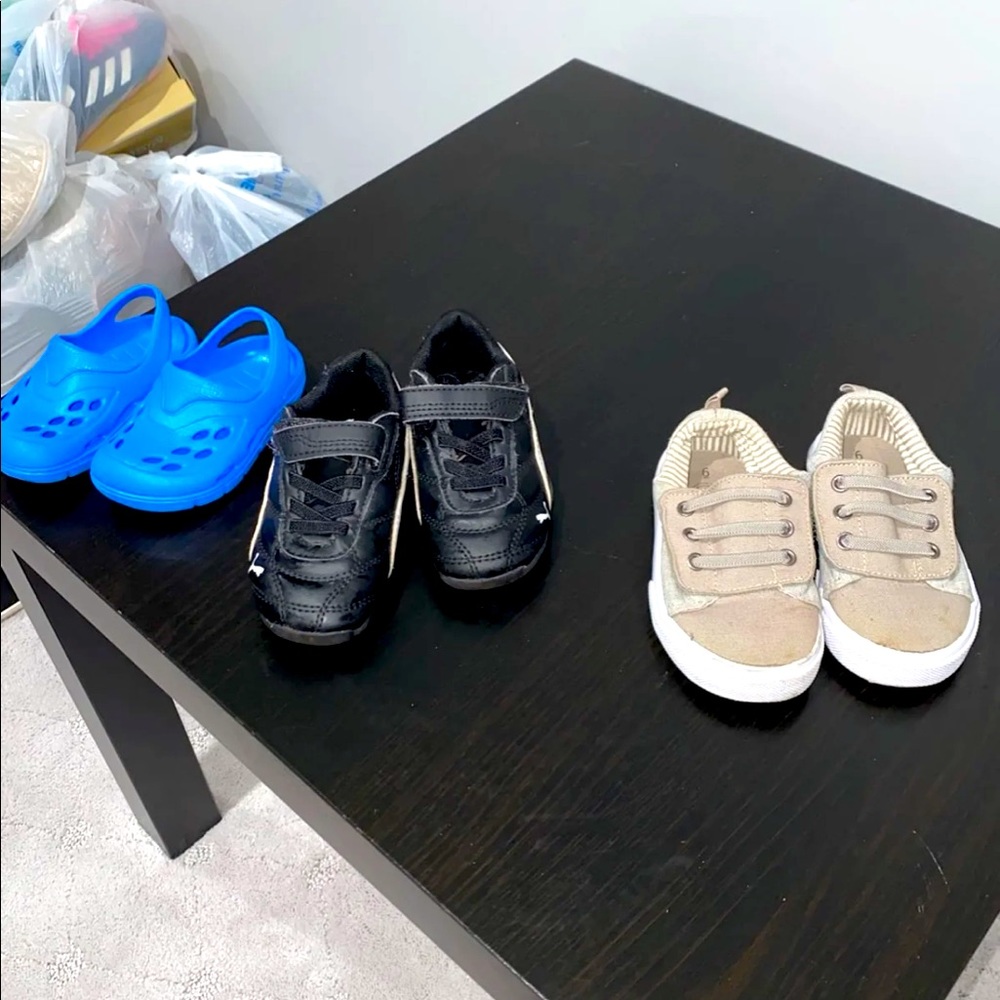 Three pairs of shoes for little boy different size